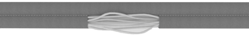 Non rifled cover | Slingmax® Rigging Solutions | Official Site | Twin-Path® Slings Cutaway view of a roundsling showing internal core fibers grouped inside the outer sleeve, without Rifled Cover Technology.